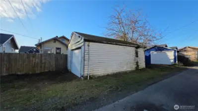 Alley access with gate to the completely fenced back yard