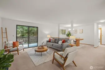 Hardwoods under carpet, check it out at the heat vents.  Have been covered since home was built.  The carpet is in great condition as well.