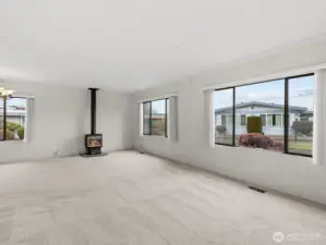 As you enter, natural light fills the home through the large windows.