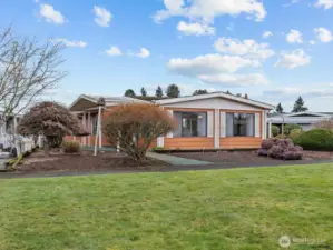 At the front of the house you have green space rather than a road to keep things more quiet and private.