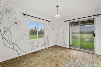 Main-floor bedroom/flexroom/office with custom textured walls and paint.