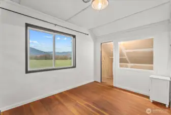 Stunning, picturesque foothills views brighten the bedroom, creating an inviting atmosphere.