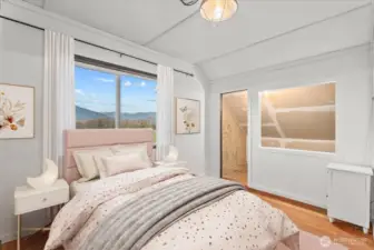 Stunning, picturesque foothills views brighten the bedroom, creating an inviting atmosphere.