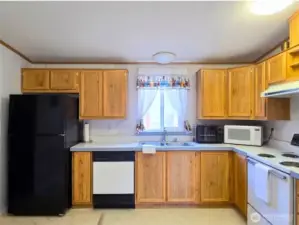 Functional kitchen with ample cabinetry and counter space designed for everyday living