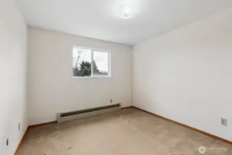 Bedroom #3.  View toward front yard. Carpeted flooring. Located on 2nd floor of home.