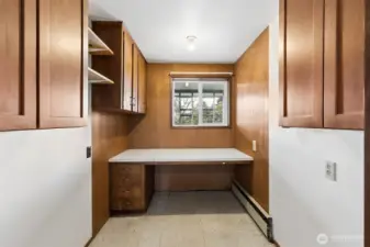 Originally the sewing room of this home and in more recent years an office! This space has potential. It's adjacent to the powder room (half bath) in the main entry. Perhaps expand that into this space for a full-bathroom.