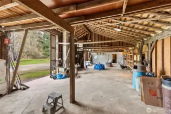 Inside the 75'x25' shop with 3 access doors. Brand new electrical panel, working lights & outlets.