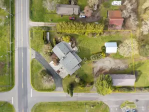 Home is at left corner facing southwest, shop at right corner, tool shed upper right