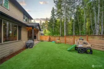 Elevated yard space with turf, and greenbelt views.