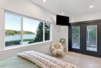 This 2nd bedroom is extra special. Imagine waking up to that view everyday. Double doors lead out to your private deck with stairs that lead down to the lower level.