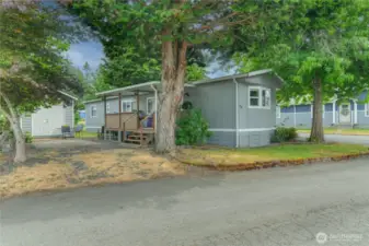 Rear entry through slider.  Cozy covered porch with view of the Lake.