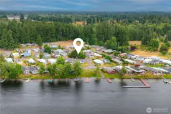 Home location in community from Black Lake view.