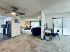 View from garage man door highlighting the kitchen, family/bonus room, dining room, and living room flow for great lvings
