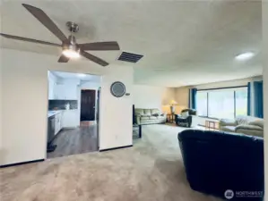 Updated kitchen, white cabinets with pull-out shelvings and pantry. Stainless steel appliances, easy access for entertaining.