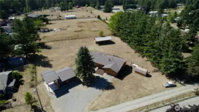 Have it all on this shy acre hobby farm. The nearly one acre of level, fully fenced land offers endless possibilities—from gardens and play areas to outdoor entertaining spaces. Privacy and room to roam are yours to enjoy.