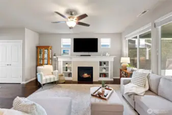 gas fireplace and built-in bookshelves.