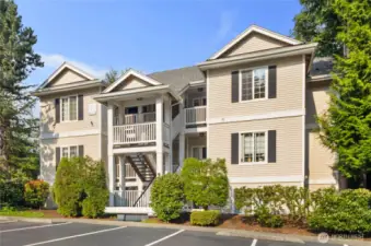 Building Exterior: Well-maintained building exterior with classic design and mature landscaping. Upper-level location provides privacy, vaulted ceilings, and serene greenbelt outlooks.