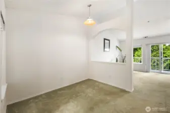 Dining Area: Defined dining space with vaulted ceilings and natural light, open to the living room and kitchen for effortless entertaining