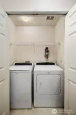 Laundry: In-unit laundry with washer and dryer included, plus storage shelf for organization.