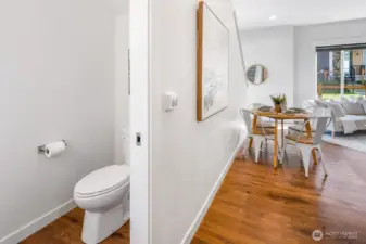 Half bath, view from garage door entrance into the home.
