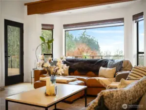 The large picture window  gives you a spectacular view of the back yard, pastures and water. Easy access to the oversized back deck.