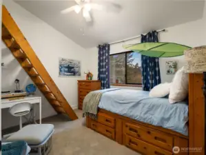 The first bedroom on the top floor has its own sleeping loft.