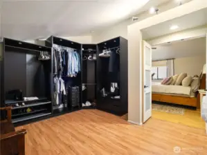 The huge walk-in closet has a designer closet organizer system with room for more if you like.