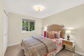 A comfortable secondary bedroom with soft carpet and a bright window that brings in natural light and neighborhood outlooks. The layout is easy to personalize, great for a guest room, hobby space, or home office. It’s a practical room that adds flexibility to how you live.