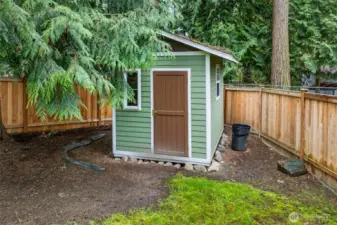 A handy storage shed provides a dedicated spot for tools, seasonal items, and yard equipment. It’s a practical feature that helps keep the main living spaces and storage areas uncluttered.