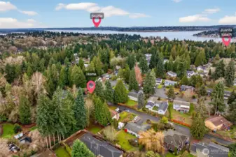 This aerial view shows the home’s location within a tree lined neighborhood, with nearby destinations called out for easy orientation. It’s a great visual of the balance here: peaceful residential setting with convenient access to area amenities and routes toward the city.