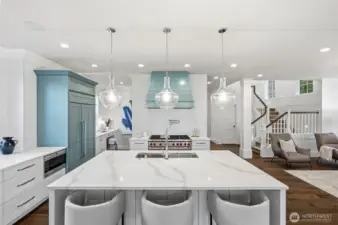 Gorgeous quartz counters, Wolf double oven and gas range, and so much more.