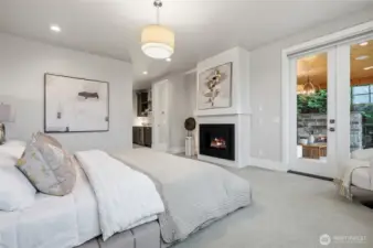 Primary with its own indoor fireplace as well as a private covered terrace.