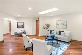 Large living room w/ cherry floors.