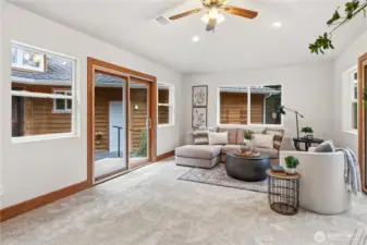 Second living/ game room w/ two sliding glass doors. One to patio and the second to a trex deck overlooking the front yard.