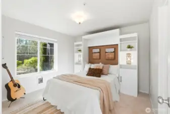 Second primary suite on the entry level with a Murphy bed.