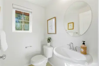 Half bathroom off of the kitchen & dining spaces.