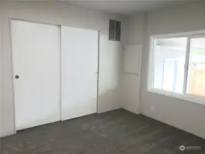 A Different View of the Large Second Bedroom with New Paint , Carpet, Carpeting Showing Huge Closet from the Bedroom Door.