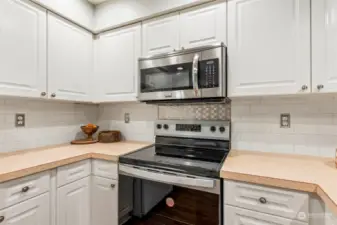 View from kitchen entrance. Plenty of cabinets & counters for meal prep.