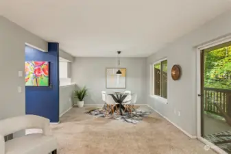 View from living room to dining room, and kitchen in the background.