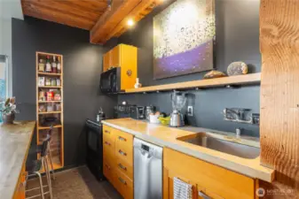 A very cool kitchen with exposed beams.