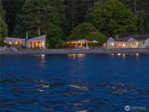 Left to right:  bunk house, cabin, outdoor kitchen cabana, main house.  And the glorious water!