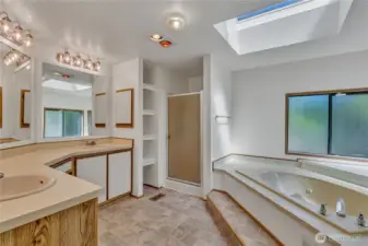 Spacious 5-piece en suite with soaking tub—ideal for relaxing.