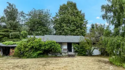 Mature landscaping provides privacy to the home.