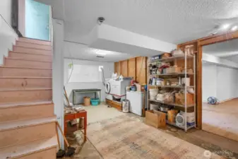 Head down stairs to the unfinished laundry room with storage space. Also providing access to the potential MIL or ADU.