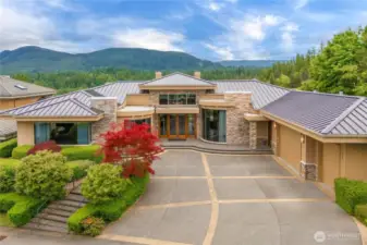 This gorgeous, expansive rambler sits proudly on the 18th hole of the golf course, offering stunning views and luxurious single-level living.  A sleek newer metal roof and 3-car garage, along with the architectural detail of this home add style and function, while the thoughtfully designed layout and impressive curb appeal make this home truly one of a kind.