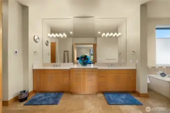 The sumptuous primary bath welcomes you in with ample vanity space, the jetted tub and separate shower, and an abundance of space.