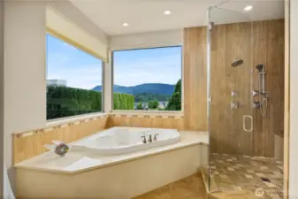 Corner bath and adjacent shower, perfect for a relaxing soak at the end of the day.