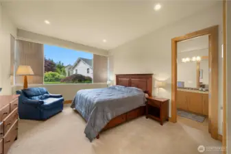 This cozy, inviting guest suite or junior primary suite offers its own bath and is situated on the front side of the house.