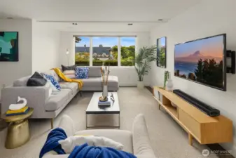 The daylight lower level features this very bright and inviting family room that looks out upon the sunny back patios and yard.