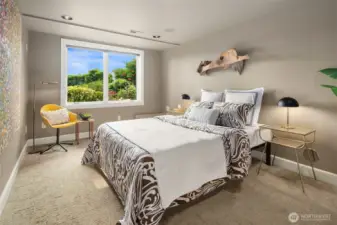 The 4th bedroom enjoys a large window looking out upon the back patios and yard, and features two closets and an attached full bath.